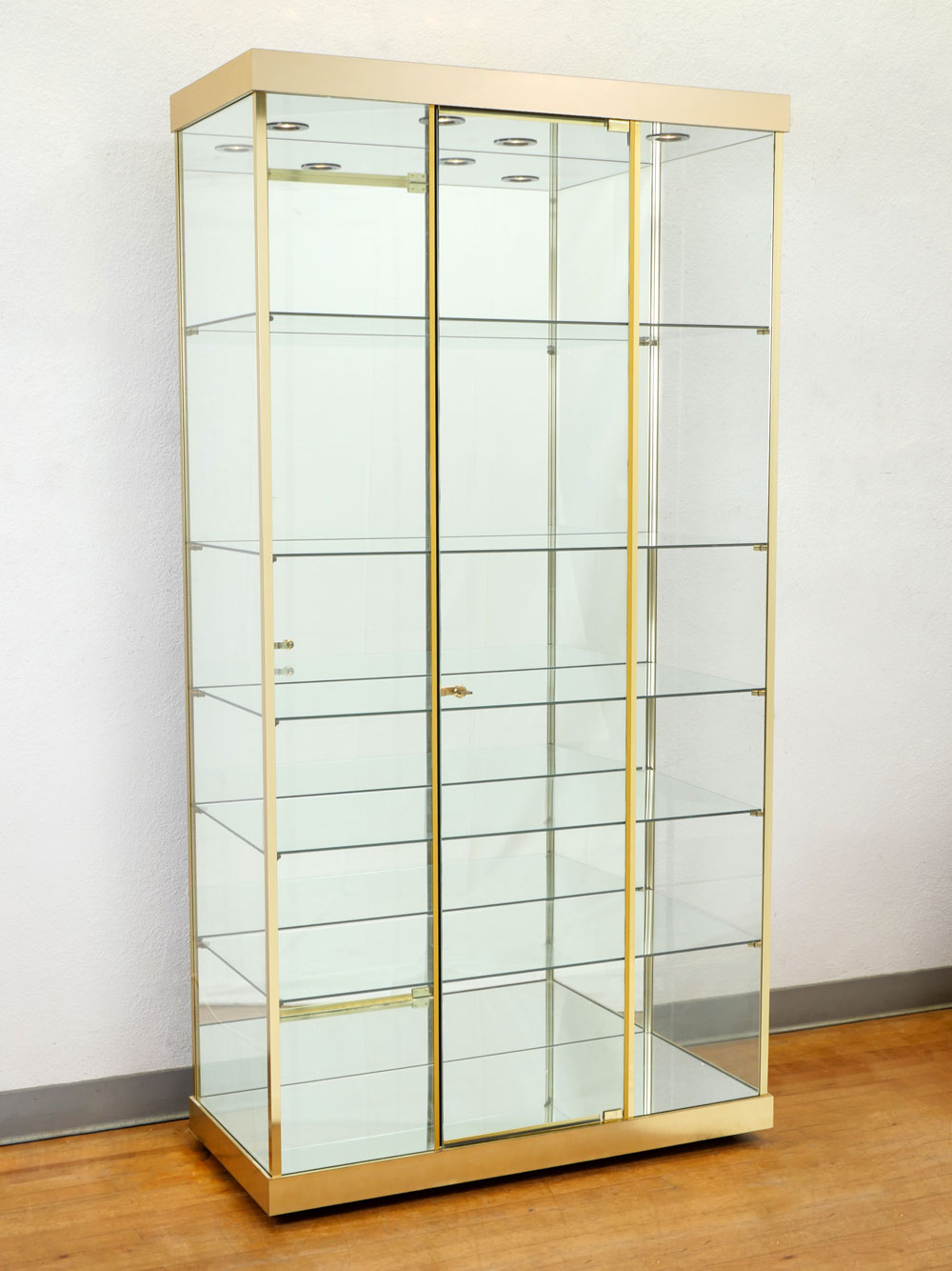 Appraisal: TECHNO LIGHTED GLASS DISPLAY CABINET Locking mirrored back shelf glass