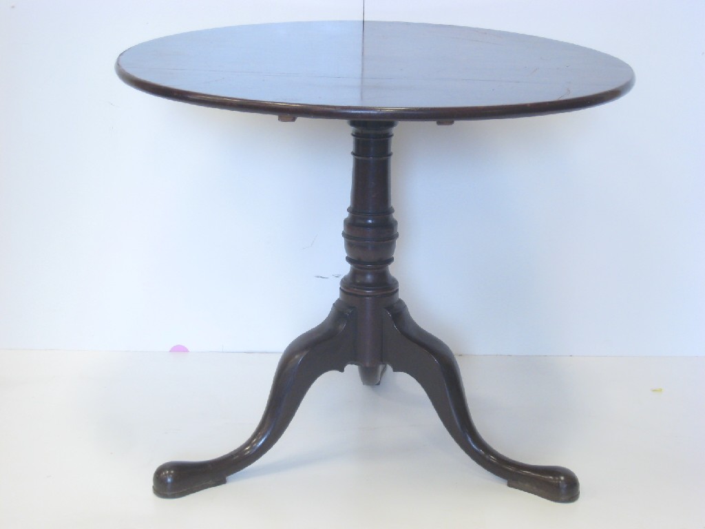 Appraisal: A Georgian mahogany Pillar Table with tilt top on turned