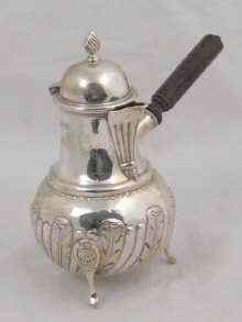 Appraisal: A hallmarked Victorian silver chocolate pot with turned wood side