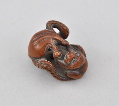 Appraisal: Netsuke of a Monkey Wrestling With Octopus by Miwa Carved