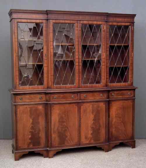 Appraisal: A modern mahogany break-front bookcase of Georgian design with moulded