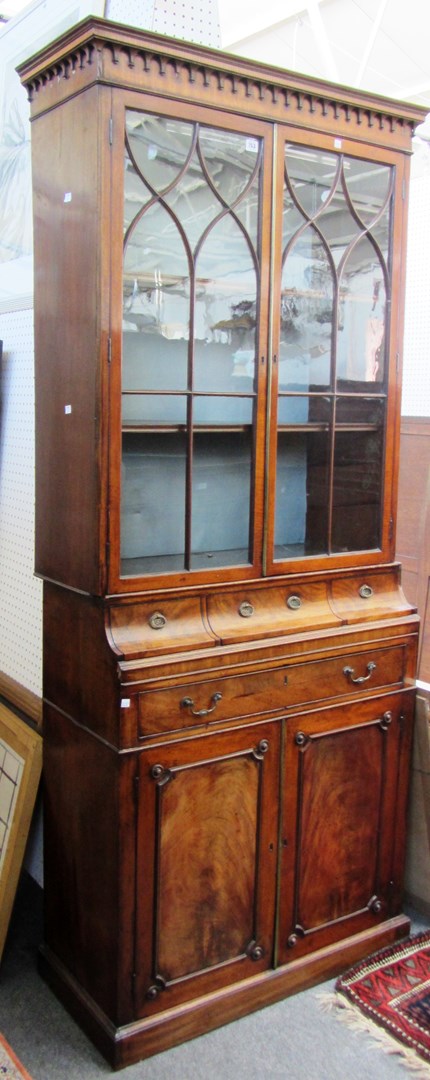 Appraisal: A late th century mahogany bookcase cabinet the pair of