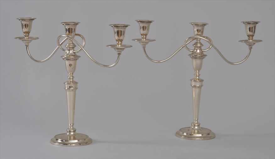 Appraisal: PAIR OF ENGLISH SILVERPLATE THREE-LIGHT CANDELABRA Each tapered stem with