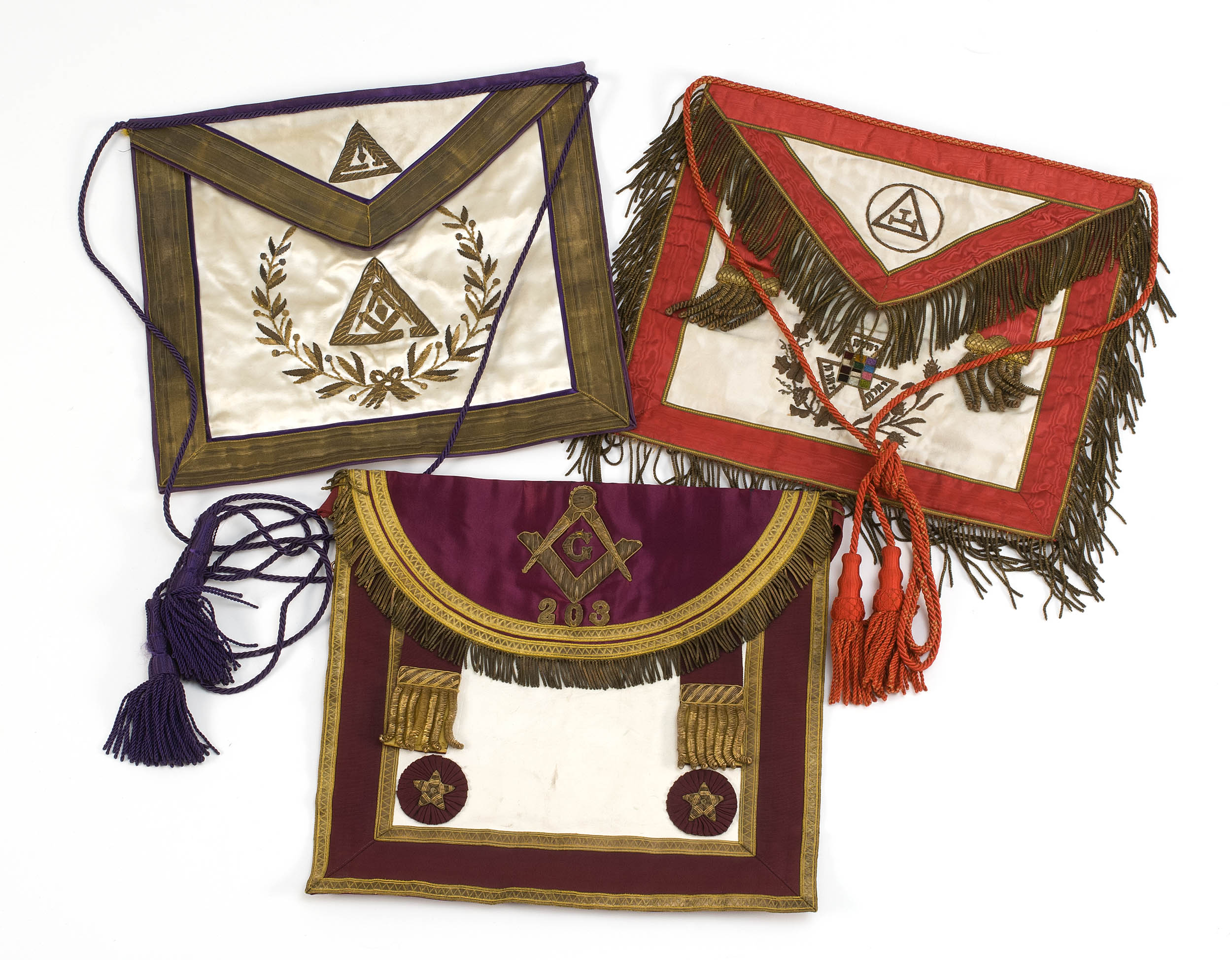 Appraisal: THREE MASONIC APRONS th CenturyAll depict various Masonic symbols One