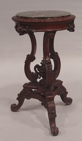 Appraisal: Walnut with tripod base and enclosed urn finial with sea