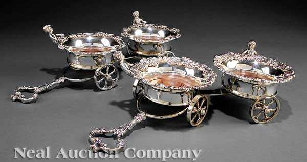 Appraisal: A Pair of Decorative Silverplate Figural Wine Trolleys each with