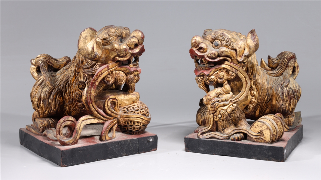 Appraisal: Pair old Chinese carved gilt wood Foo lions light gilt