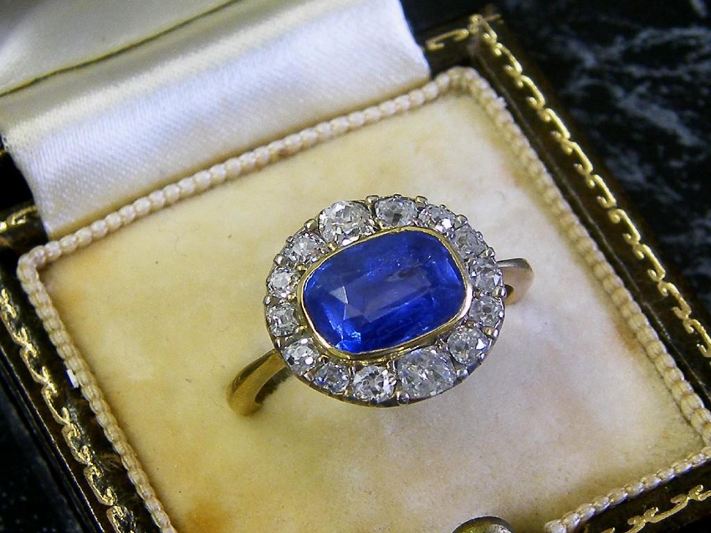 Appraisal: Good period ct oval sapphire and diamond cluster ring sapphire