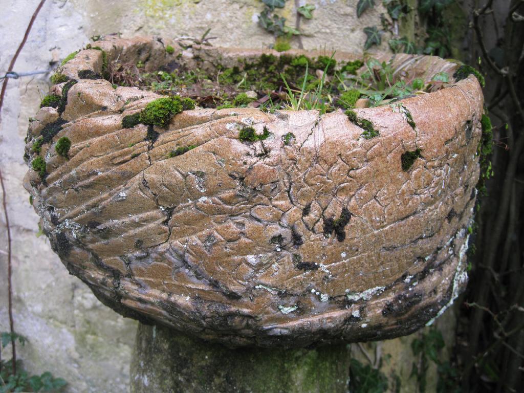 Appraisal: A glazed rustic stoneware shaped circular Planter in diam