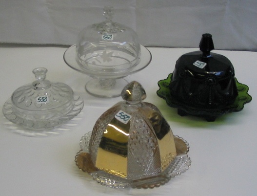 Appraisal: A COLLECTORS GROUP OF FOUR CLEAR AND COLORED GLASS BUTTER