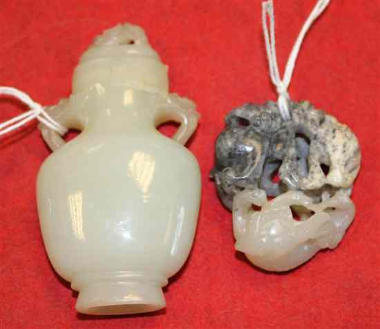 Appraisal: A Chinese three colour jade carving of three Buddhist lions