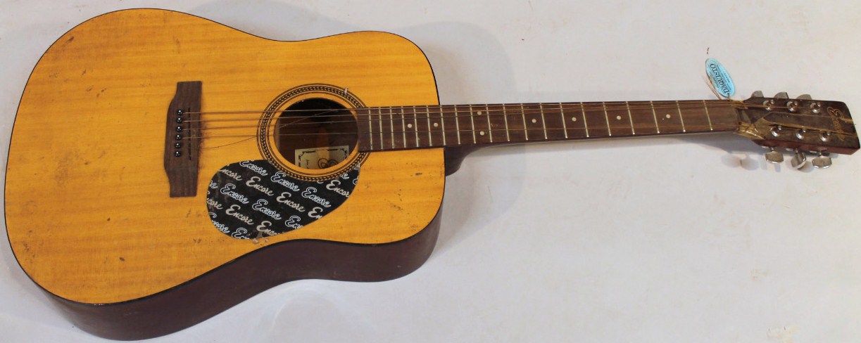 Appraisal: An Encore W acoustic guitar with a two piece back