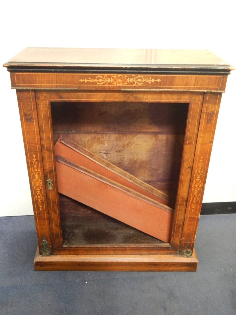 Appraisal: A Victorian walnut ebonised and satinwood inlaid pier cabinet the