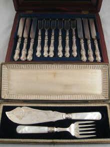 Appraisal: A Mahogany box with lift out tray containing a dozen