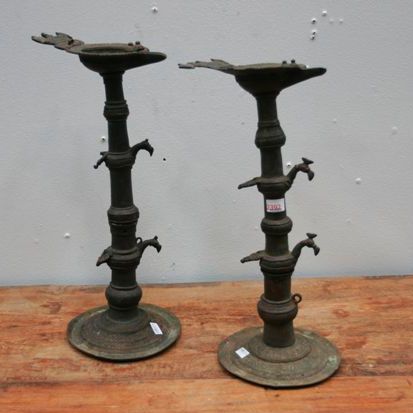 Appraisal: A pair of cast brass Dokra tribal oil lamps cast