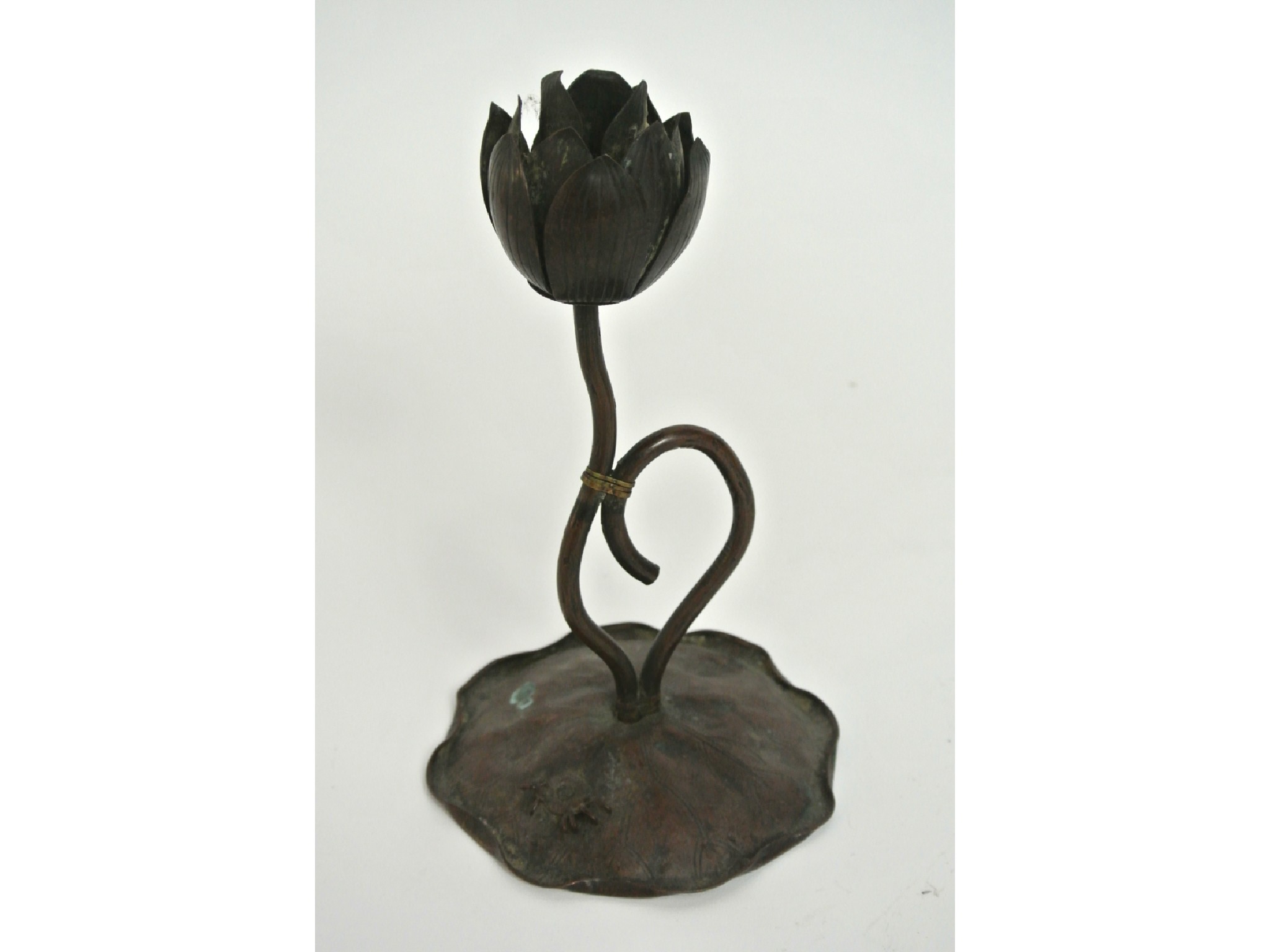 Appraisal: A Japanese bronzed metalwork candlestick the bowl in the form