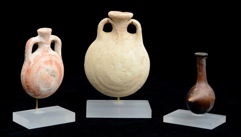 Appraisal: TWO CYPRIOT POTTERY FLASKS AND A ROMAN GLASS BABY FEEDER