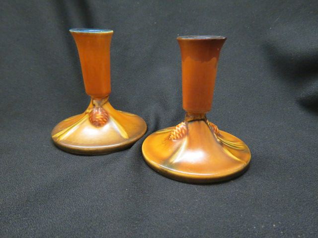 Appraisal: Pair of Roseville Pottery Pinecone Candlesticksbrown - one repaired