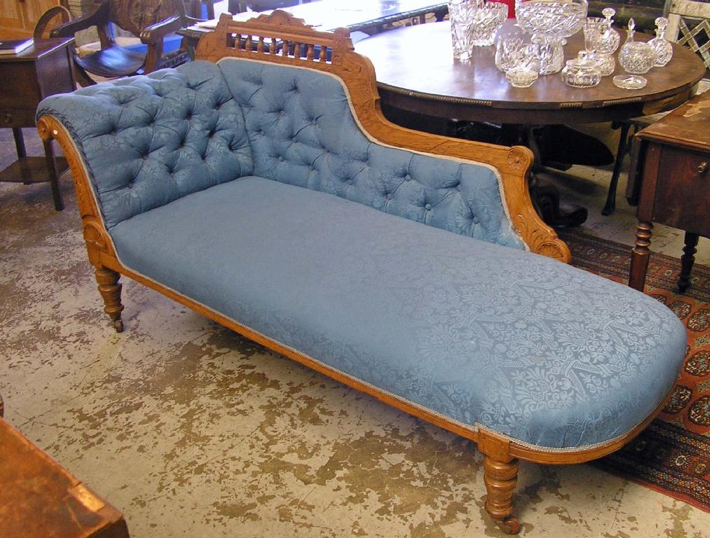 Appraisal: A Victorian oak framed chaise longue upholstered in blue material