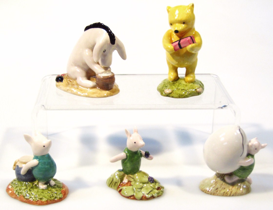 Appraisal: Five Royal Doulton Winnie The Pooh porcelain figures Eeyore's Birthday