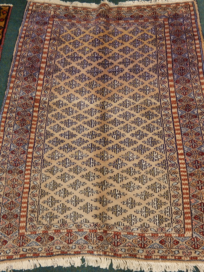 Appraisal: A Turkoman rug with a lozenge design on a beige