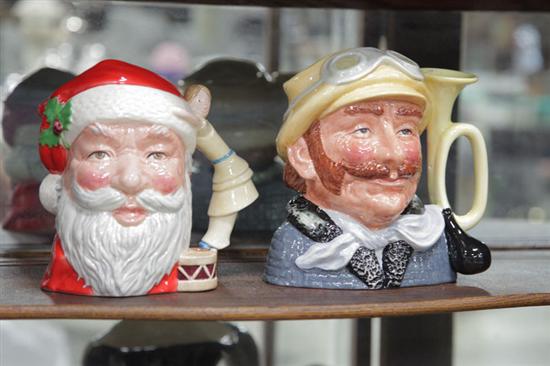 Appraisal: TWO ROYAL DOULTON CHARACTER MUGS ''Santa Claus'' D '' h