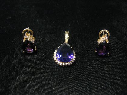 Appraisal: Amethyst pendant and earrings Pear shaped amethyst set amongst approximately