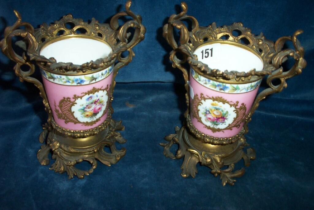 Appraisal: A pair of th century continental pink ground vases with