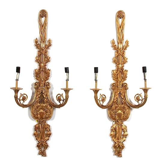 Appraisal: A Pair of Louis XVI Style Brass Two-Light Wall Sconces