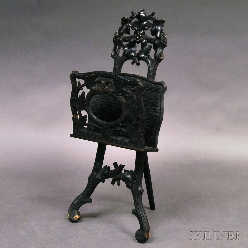 Appraisal: Carved Black Forest Magazine Stand th century imperfections ht wd