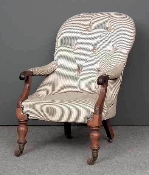 Appraisal: A Victorian mahogany framed spoon back open arm easy chair