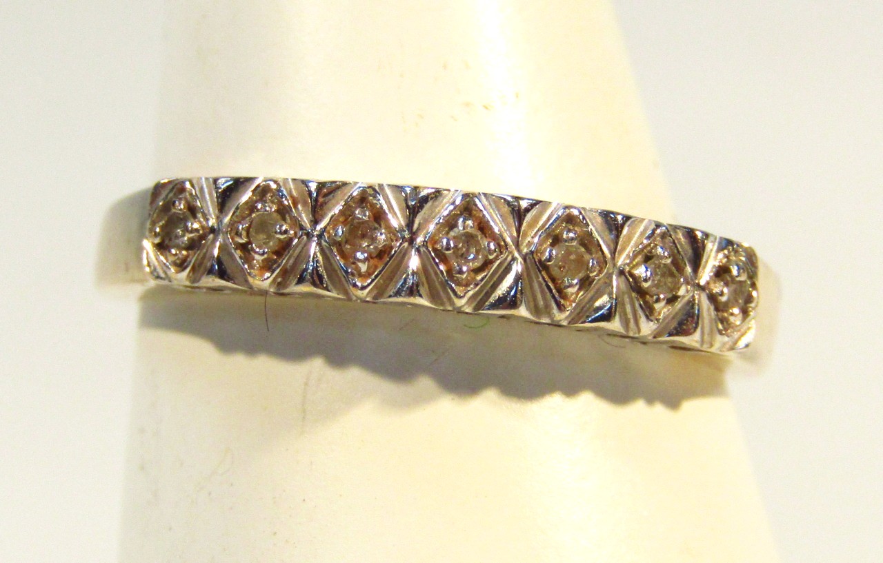 Appraisal: A ct gold half eternity dress ring set with seven