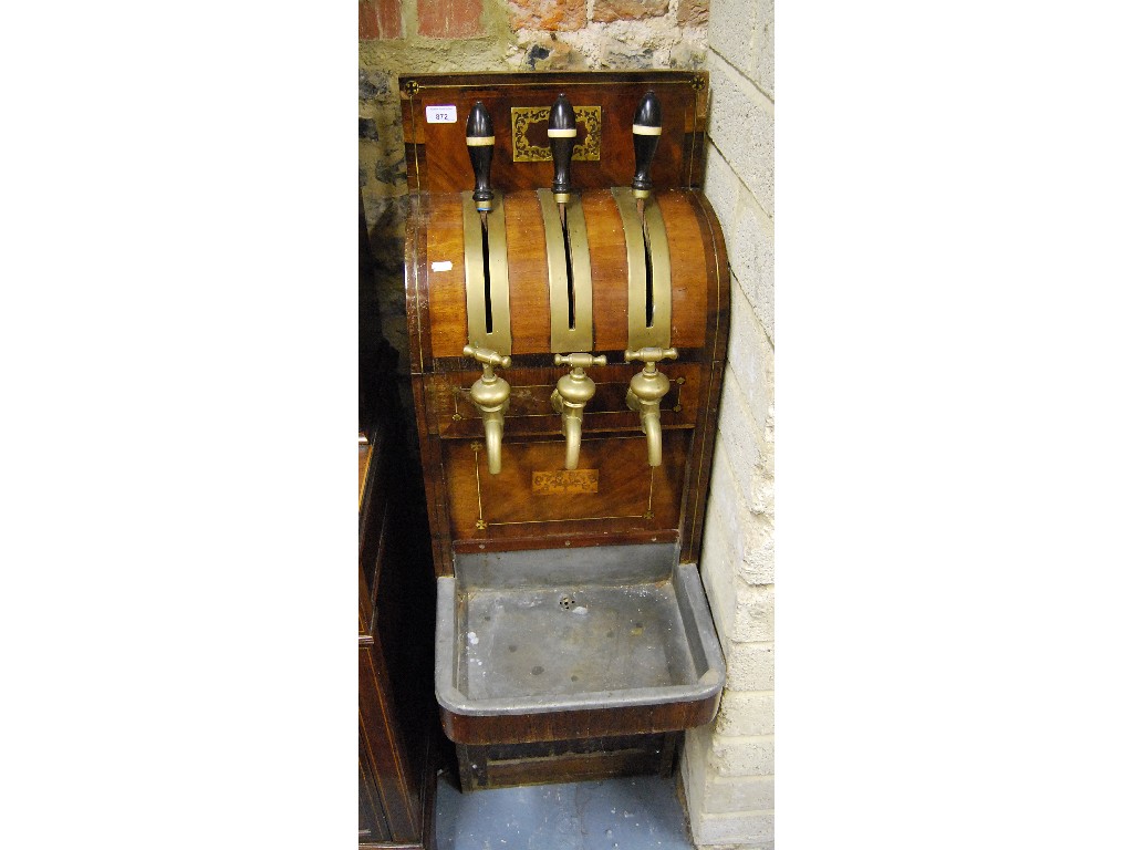 Appraisal: A Continental brass mounted mahogany and rosewood beer pump with