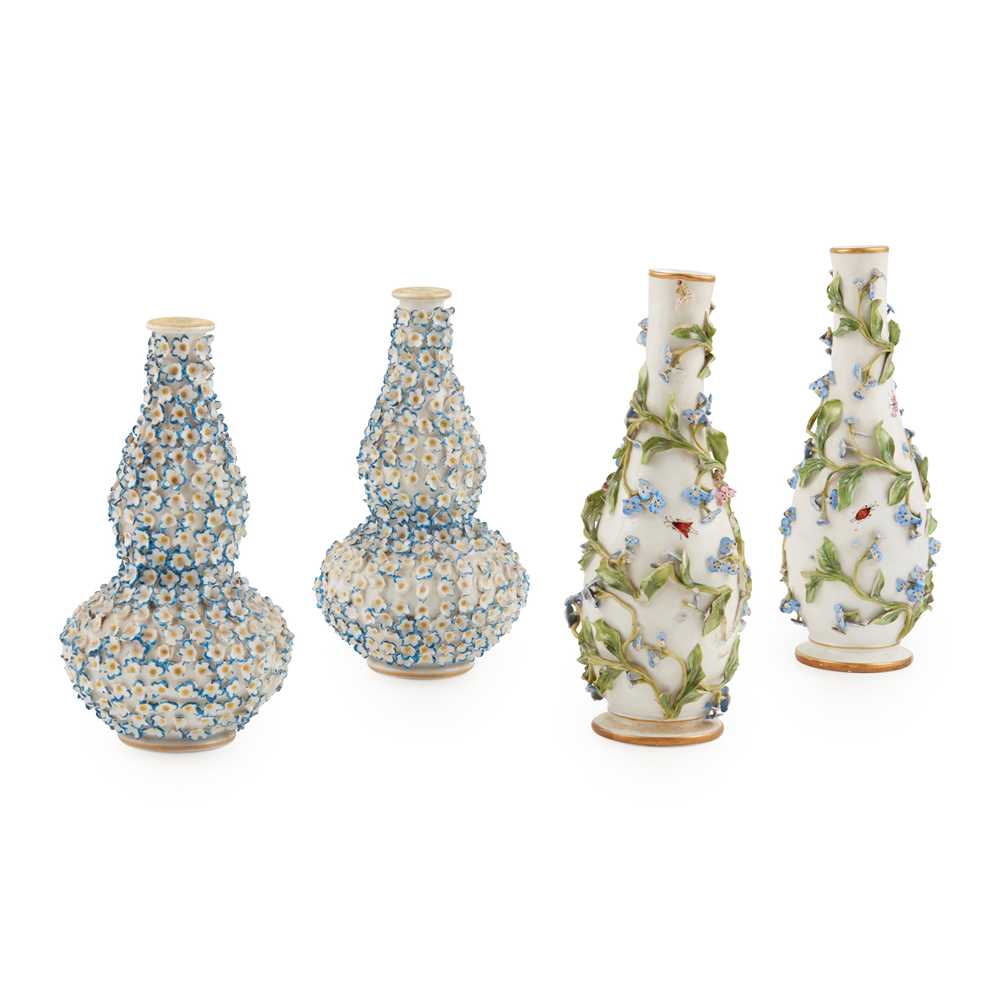 Appraisal: PAIR OF MEISSEN FLORAL ENCRUSTED BOTTLE VASES MID TH CENTURY