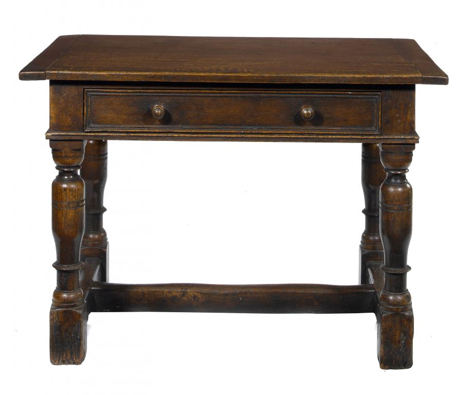 Appraisal: AN OAK TABLE the boarded top with cleated ends and