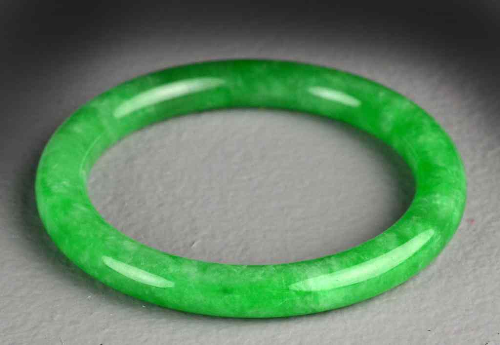 Appraisal: Chinese Apple Green Jadeite Bangle BraceletUncarved with very fine polish