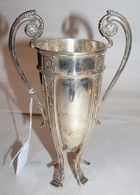 Appraisal: A TWO HANDLED SILVER VASE standing on cabriole legs with