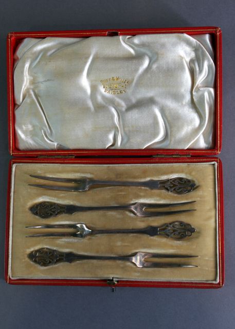 Appraisal: A boxed set of four pickle forks with delicately pierced