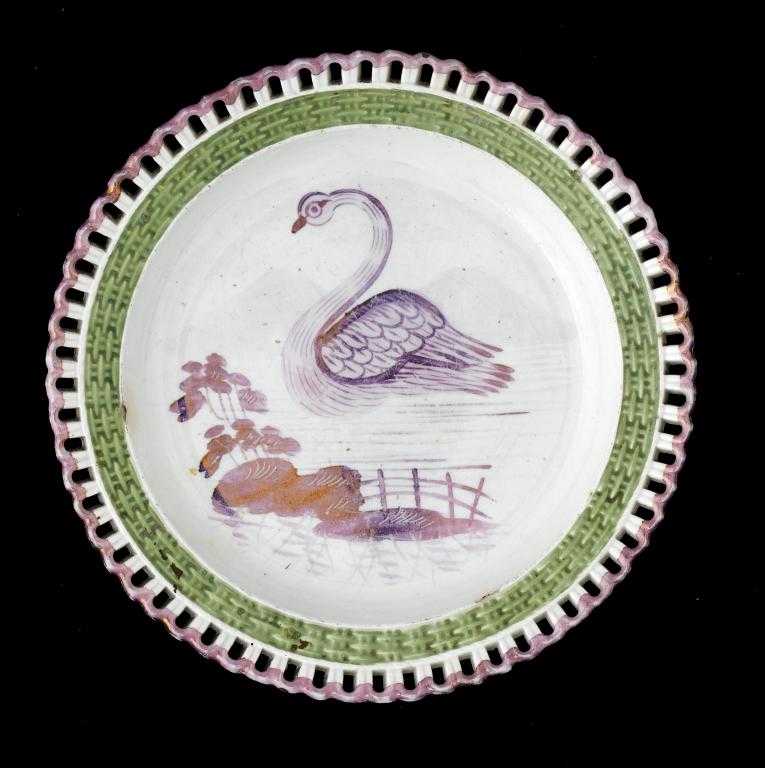 Appraisal: A SWANSEA PEARLWARE PLATE painted in purple lustre with a