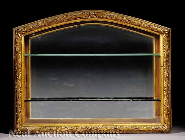 Appraisal: A Carved Mahogany and Giltwood Hanging Vitrine c arched acanthus