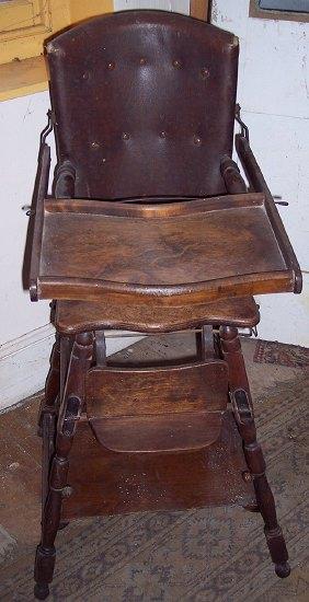 Appraisal: A child's th Century commode seat high chair with food