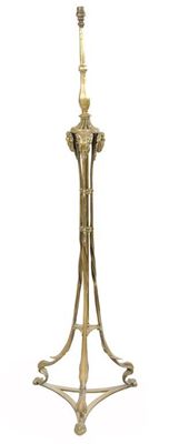 Appraisal: A brass standard lamp with cast ram's heads on tripod