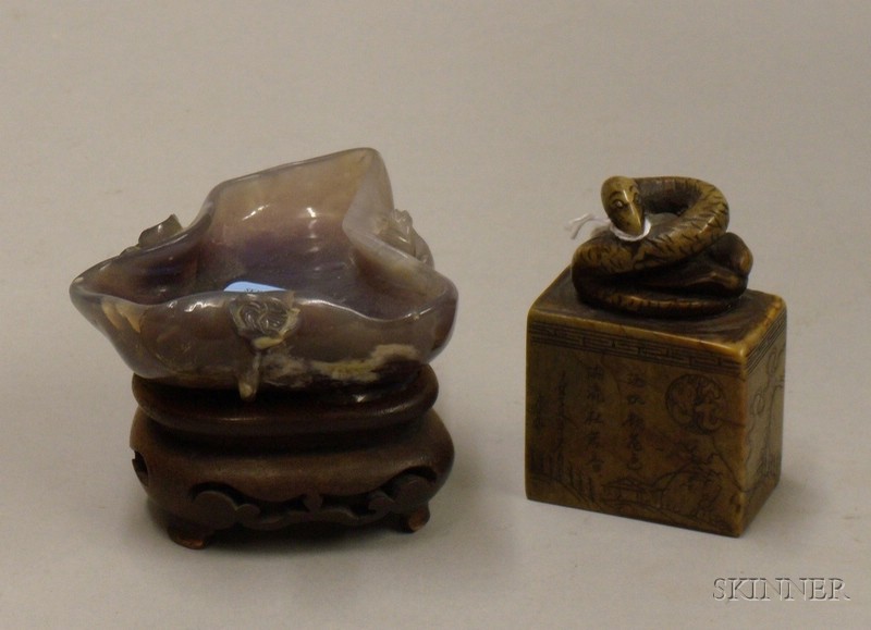 Appraisal: Chinese Carved Soapstone Seal and Carved Amethyst-colored Hardstone Figural Cup