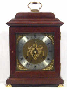 Appraisal: A mahogany striking mantel clock with day movement and brass