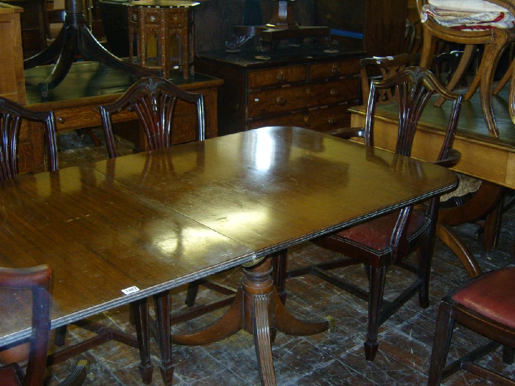 Appraisal: A Georgian style -pillar extending dining table of rectangular form