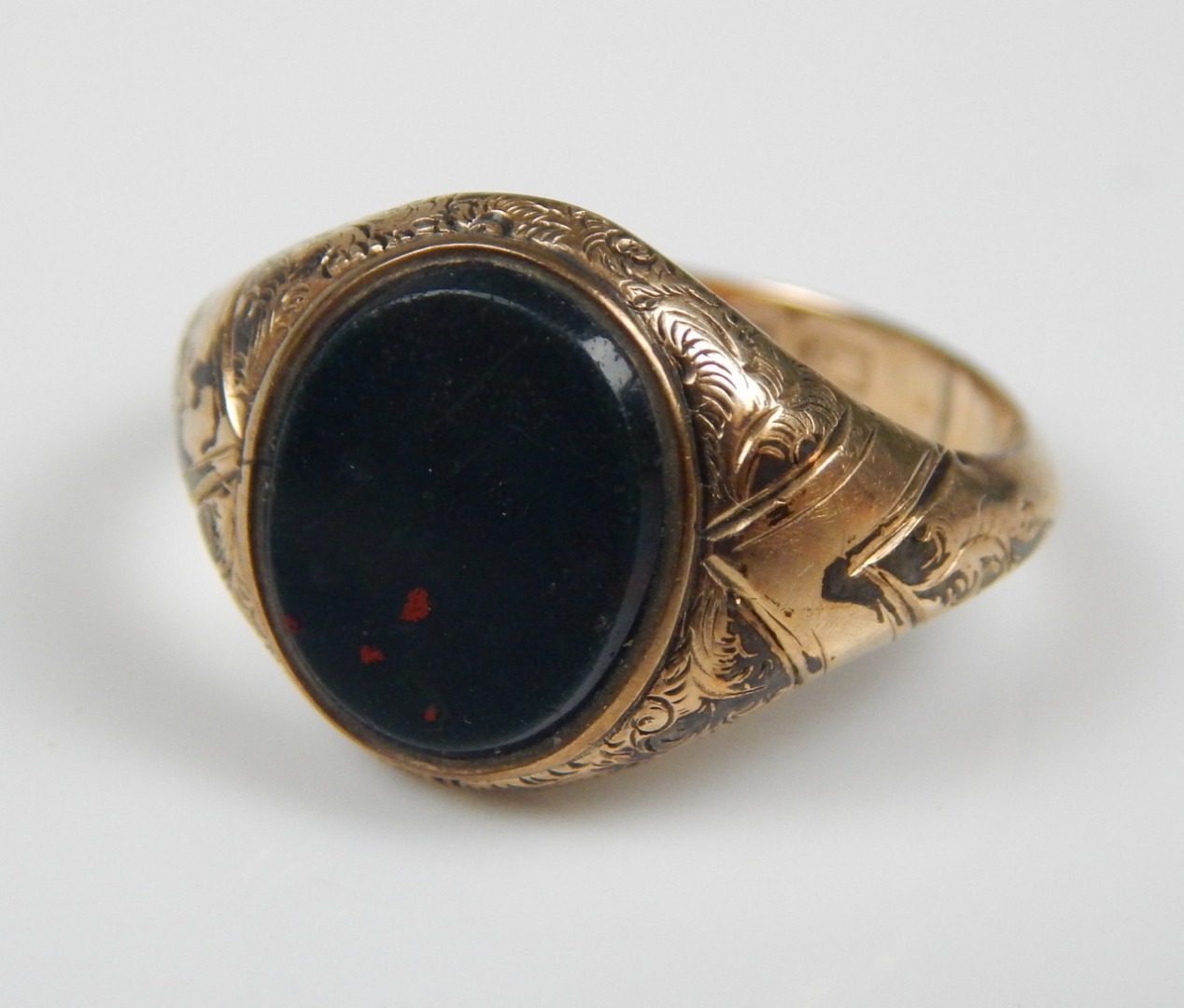 Appraisal: A ct gold signet ring with central green agate g