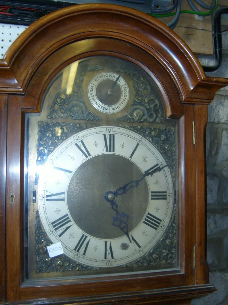 Appraisal: A mahogany longcase clock with full length glazed panelled door