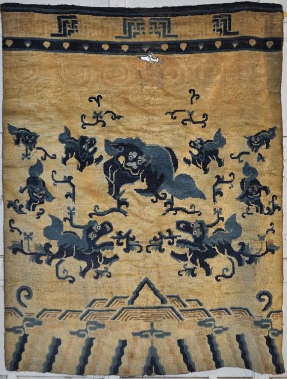 Appraisal: Tibetan Foo Dog Motif Pillar Carpet possibly silk blend mounted