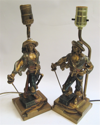 Appraisal: PAIR GILT FIGURAL TABLE LAMPS a young man wearing a