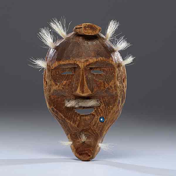 Appraisal: Eskimo Wooden Ancestor Mask carved with delicate features and augmented